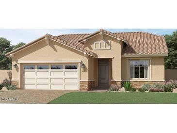 Inviting single-story home showcasing a charming front yard, neutral-toned stucco, and a convenient two-car garage at 17363 W Fallen Leaf Ln, Surprise, AZ 85387