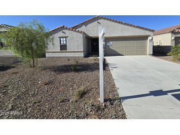 Charming single-story home with a gravel front yard and a two-car garage, offering modern suburban living at 18361 E Eloisa Dr, Gold Canyon, AZ 85118