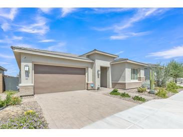 Charming single-story home featuring desert landscaping, neutral color palette, and a two car garage at 22218 N 28Th St, Phoenix, AZ 85050