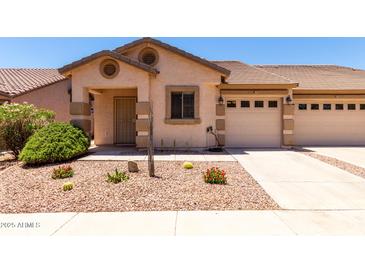 Charming home featuring desert landscaping, a tile roof, and an attached two-car garage at 2250 E Deer Valley Rd # 96, Phoenix, AZ 85024