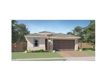 Charming home featuring a well-manicured lawn, a neutral color scheme, and a two-car garage at 3129 S 155Th Ln, Goodyear, AZ 85338