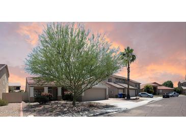 Charming home featuring a well-manicured yard, desert landscaping and tile roof at 351 N Newport St, Chandler, AZ 85225