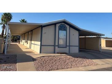 Manufactured home featuring covered parking at 9302 E Broadway Rd # 129, Mesa, AZ 85208