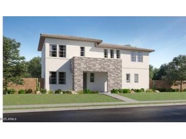 Inviting two-story home featuring a stone entryway and modern architectural design at 10047 E Ulysses Ave, Mesa, AZ 85212