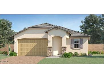Charming single-story home featuring a two-car garage and desert landscaping at 15600 W Williams St, Goodyear, AZ 85338