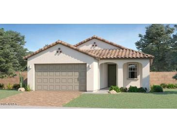 Charming single-story home featuring a neutral color palette, a two-car garage, and a classic tile roof at 15627 W Williams St, Goodyear, AZ 85338