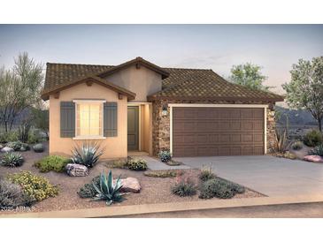 Charming single-story home showcasing a stylish facade with a stone accent, desert landscaping, and a two-car garage at 21298 N 270Th Dr, Buckeye, AZ 85396