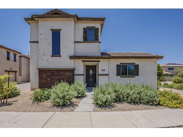 Charming two-story home features desert landscaping and a welcoming front entrance at 2540 N 148Th Dr, Goodyear, AZ 85395