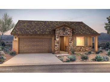Charming single-story home with a stone facade, tile roof, and well-manicured landscaping at 26651 W Kimberly Way, Buckeye, AZ 85396