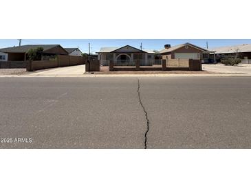 Charming single-story home featuring a well-maintained front yard and inviting curb appeal at 2745 E Wood St, Phoenix, AZ 85040