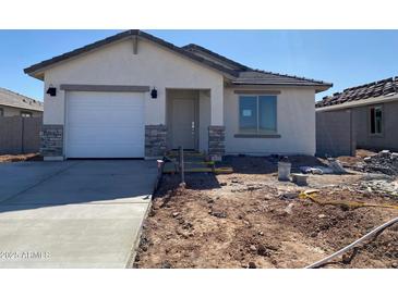 Charming single-story home with stucco siding, attached garage, stone accents and tile roof at 32016 N Pony Express Rd, San Tan Valley, AZ 85143