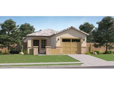 Charming single-story home with a two-car garage, well-maintained lawn, and inviting curb appeal at 36600 W Maddaloni Ave, Maricopa, AZ 85138