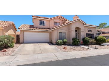 Charming two-story home features a tile roof and attached two-car garage at 3871 W Linda Ln, Chandler, AZ 85226