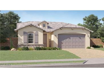 Charming single-story home with stucco exterior, gray shutters, and a well-manicured lawn at 9522 W Avalon Dr, Phoenix, AZ 85037