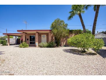 Charming single-story home featuring well-kept landscaping and classic desert style features at 12220 N 22Nd Pl, Phoenix, AZ 85022