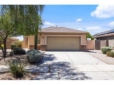 Charming single-Gathering home with a well-maintained front yard and a two-car garage at 12732 S 175Th Dr, Goodyear, AZ 85338
