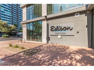 Exterior view of the Edison Midtown building entrance with modern architecture and landscaping at 3131 N Central Ave # 3004, Phoenix, AZ 85012