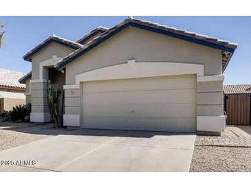 Charming single-story home with desert landscaping and a two-car garage at 3905 E Kristal Way, Phoenix, AZ 85050