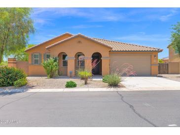 Charming single-story home with a well-maintained front yard and a neutral-colored facade at 40479 W Marion May Ln, Maricopa, AZ 85138