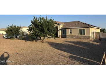 Charming single-story home with low maintenance desert landscaping and beautiful curb appeal at 9759 E Brown Rd, Mesa, AZ 85207