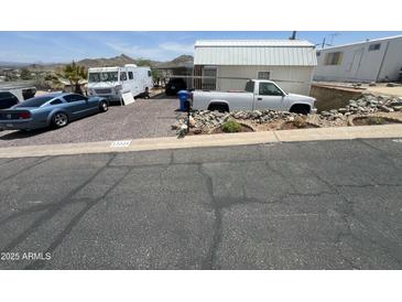 Charming mobile home with ample parking and well-maintained landscaping at 13205 N 18Th Pl, Phoenix, AZ 85022