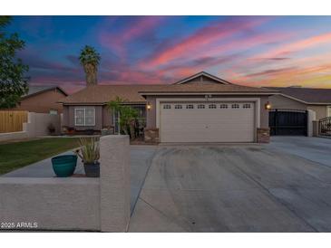 Charming single-story home boasting a spacious driveway and two-car garage in a well-maintained neighborhood at 1814 N 89Th Ave, Phoenix, AZ 85037