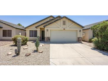 Charming single-story home with a two-car garage and low-maintenance desert landscaping at 3011 W Salter Dr, Phoenix, AZ 85027