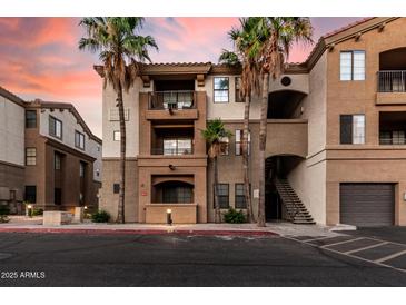 Beautiful condo building with desert landscaping, balconies, and attractive architectural details at 5302 E Van Buren St # 2024, Phoenix, AZ 85008