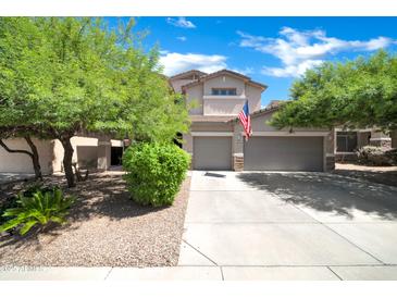 Beautiful two-story home with a three-car garage and well-maintained landscaping at 10430 W Los Gatos Dr, Peoria, AZ 85383
