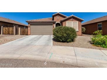 Charming single-story home with a well-maintained yard and a two-car garage at 2391 S 171St Ln, Goodyear, AZ 85338