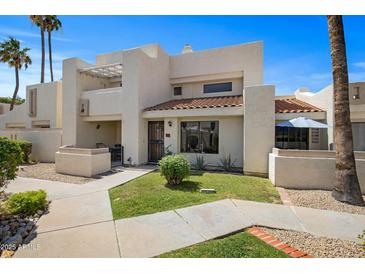 Inviting two-story home with a well-manicured lawn, front patio, and desert landscaping at 848 E Morningside Dr, Phoenix, AZ 85022