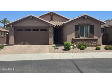 Charming single-story home featuring a well-manicured front yard and a two-car garage at 120 E Horseshoe Dr, Chandler, AZ 85249