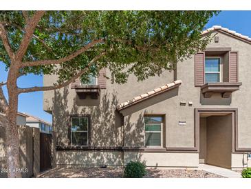 Inviting two-story home with a well-maintained exterior and desert landscaping at 1255 S Rialto -- # 115, Mesa, AZ 85209