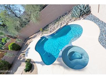 Backyard pool with lounge seating and desert landscaping at 1332 E Charleston Ave, Phoenix, AZ 85022