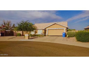Charming single-Gathering home with a two-car garage and low-maintenance desert landscaping at 16011 N 35Th Dr, Phoenix, AZ 85053