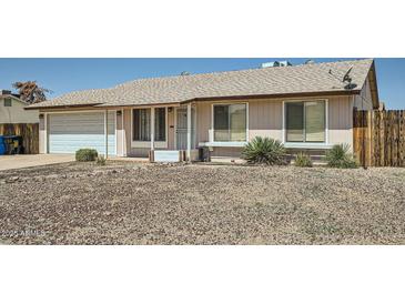 Charming single-story home featuring a two-car garage and desert landscaping at 17232 N 29Th Ave, Phoenix, AZ 85053