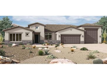 Stunning single-story home featuring a three-car garage and desert landscaping at 18130 E Silver Creek Ln, Queen Creek, AZ 85142
