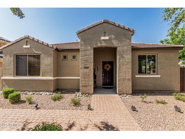 Inviting single-story home with a charming brick walkway leading to the front door at 1849 S Balboa Dr, Gilbert, AZ 85295
