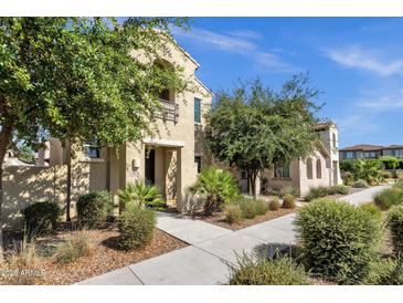 Charming two-story home featuring a private balcony and desert landscaping at 3131 S Mingus Dr, Chandler, AZ 85286