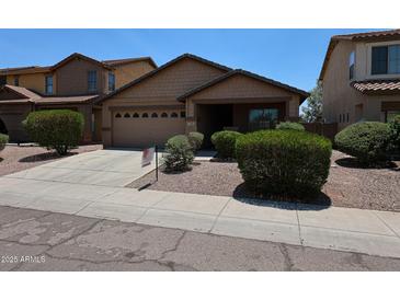 Inviting single-story home with a two-car garage, well-maintained landscaping and a charming, covered entryway at 3545 W Glass Ln, Phoenix, AZ 85041