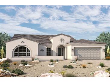 Charming single-story home boasts a neutral palette, desert landscaping, and a welcoming arched entry, embodying Southwestern elegance at 6853 N 190Th Dr, Waddell, AZ 85355