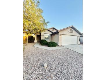 Charming single-story home featuring a low-maintenance desert landscape and attached two-car garage at 22951 W Loma Linda Blvd, Buckeye, AZ 85326