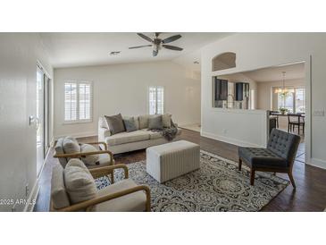 Bright living room featuring stylish furniture, ceiling fan, and an open view to the kitchen at 890 N Bogle Ct, Chandler, AZ 85225