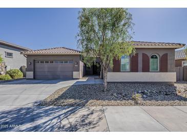 Charming single-story home featuring desert landscaping and a two-car garage at 16836 W Vereda Solana Dr, Surprise, AZ 85387