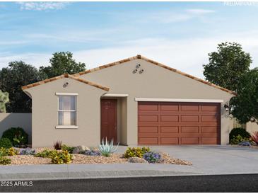 Charming single-story home with neutral colors, a two-car garage, and low-maintenance desert landscaping at 17334 W Eva St, Waddell, AZ 85355
