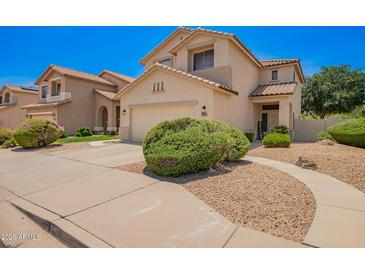 Charming two-story home with a well-manicured front yard and a welcoming entrance at 25210 N 40Th Ave, Phoenix, AZ 85083