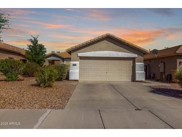 Charming single-story home with a two-car garage and well-maintained landscaping at 4251 E Sundance Ave, Gilbert, AZ 85297