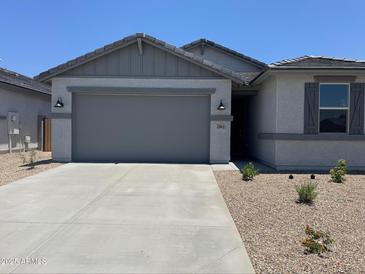 Charming single-story home featuring a spacious two-car garage and low-maintenance desert landscaping at 22913 N 183Rd Dr, Surprise, AZ 85387