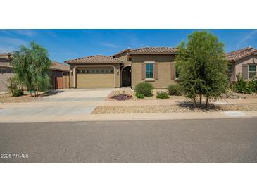 Charming single-story home featuring a well-manicured yard and a neutral color palette at 24478 N 166Th Ave, Surprise, AZ 85387