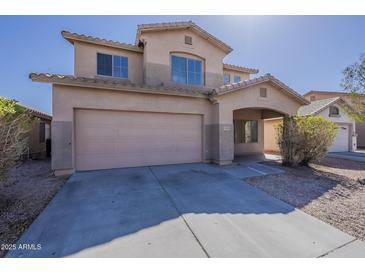Charming two-story home featuring a two-car garage and covered entryway in a well-maintained community at 9939 W Southgate Ave, Tolleson, AZ 85353